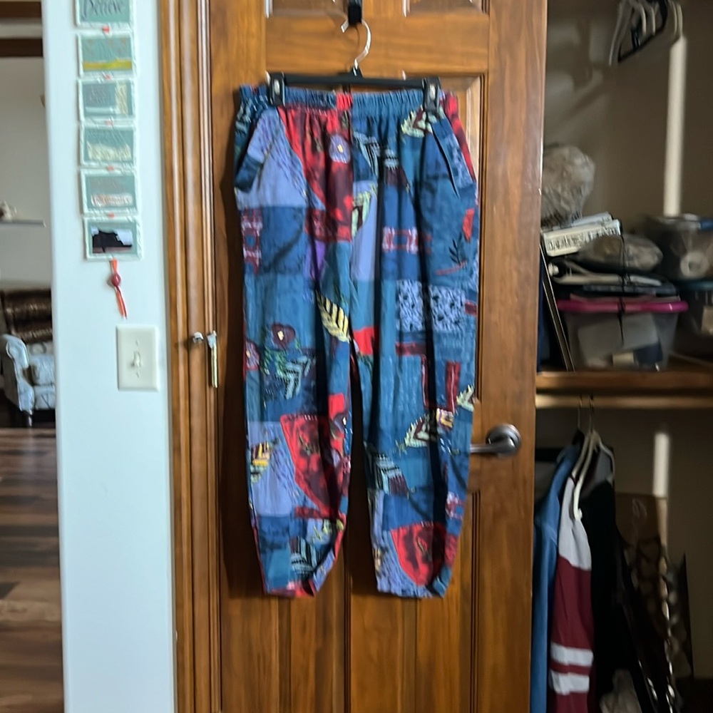 Pants. Mostly blue with a patchwork style print